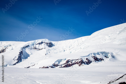 Magnificent view of the snow-white tall mighty mountains Elbrus, ski resort, the Republic of Kabardino-Balkaria, Russia