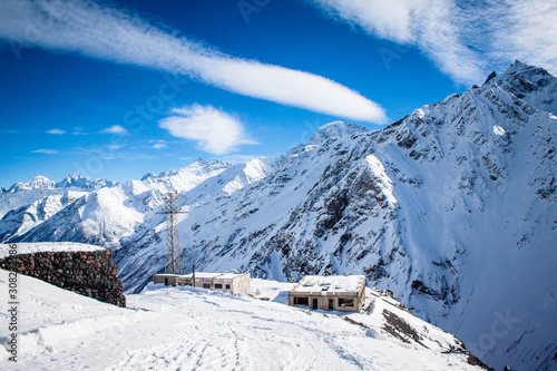 Magnificent view of the snow-white tall mighty mountains Elbrus, ski resort, the Republic of Kabardino-Balkaria, Russia