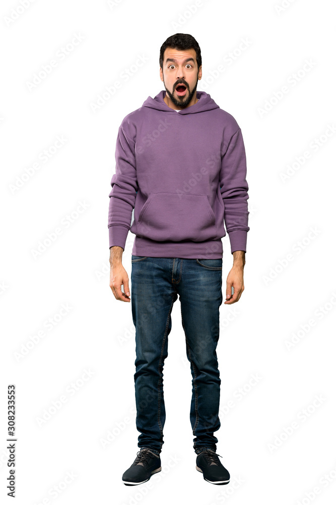 Full-length shot of Handsome man with sweatshirt with surprise facial expression over isolated white background Full-length shot of Handsome man with sweatshirt with surprise facial expression over isolated white background