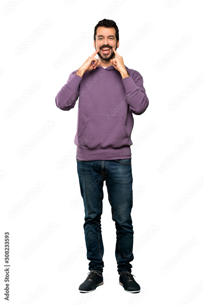 Full-length shot of Handsome man with sweatshirt smiling with a happy and pleasant expression over isolated white background Full-length shot of Handsome man with sweatshirt smiling with a happy and pleasant expression over isolated white background