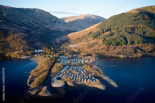 Caravan site island park at lake water edge aerial view closed during winter season at Loch Lomond Scotland UK photo
