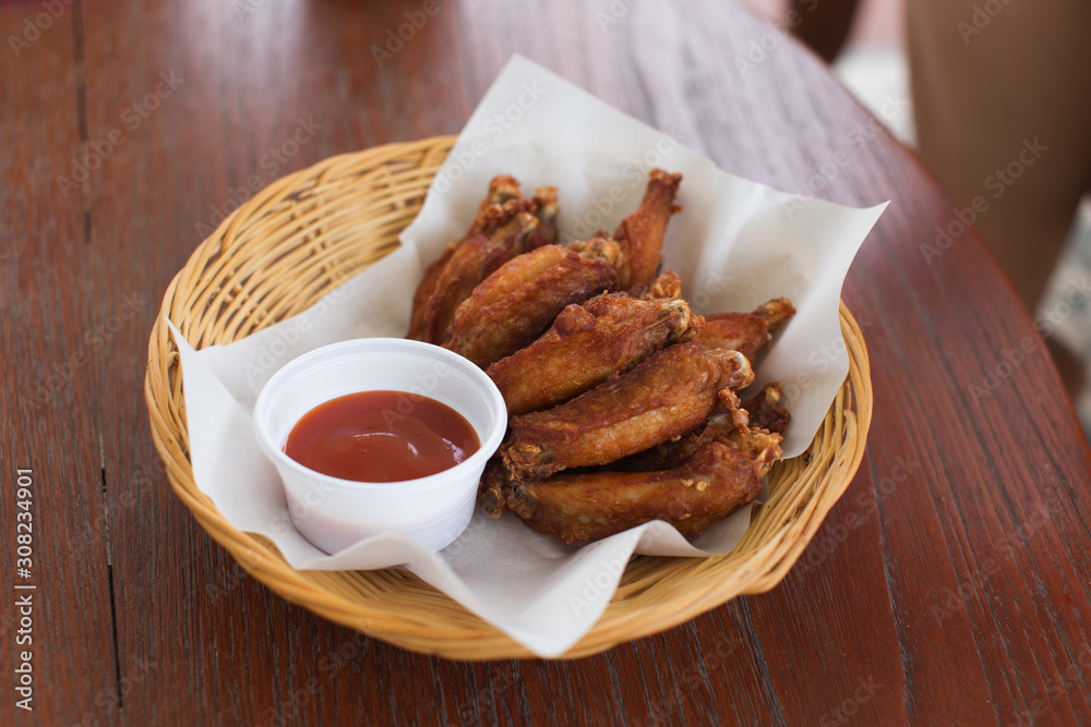 Fried chicken wings in the basket Fried chicken wings in the basket