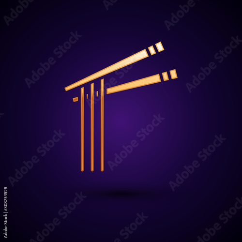 Gold Asian noodles and chopsticks icon isolated on dark blue background. Street fast food menu. Korean, Japanese, Chinese food. Vector Illustration