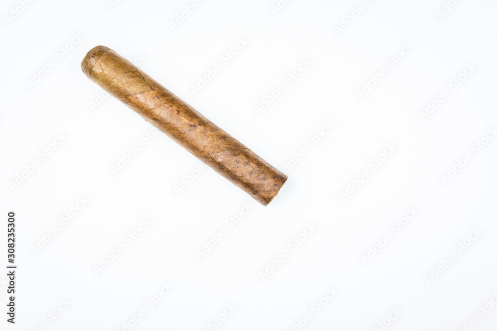 Havana thick cigar from twisted sheets on white background. Havana thick cigar from twisted sheets on white background.
