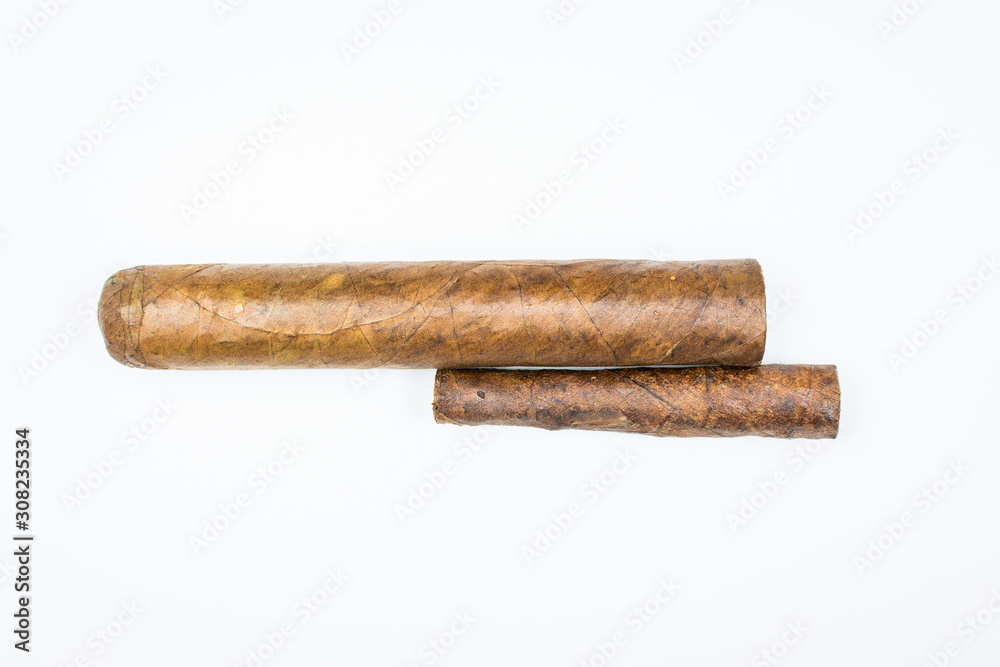 Two best cigars from twisted sheets on white background. Two best cigars from twisted sheets on white background.