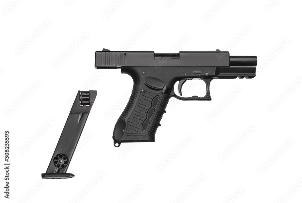 Pneumatic pistol isolated on white background. Air gun on a lighten background with a place for inscription. Modern air gun with a taken away magazine. Non-lethal weapons for sports and entertainment.