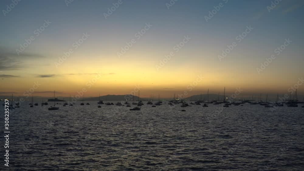 Colaba Sunrise view, with birds flying by through and boats in the Background (Slow Motion) Colaba Sunrise view, with birds flying by through and boats in the Background (Slow Motion)
