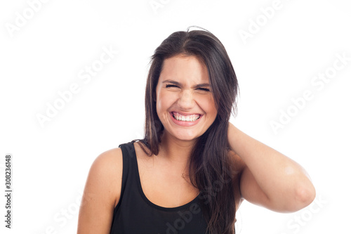 portrait of a happy young brunette woman laughing © JPchret