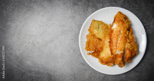 Fotografie, Tablou fried fish fillet sliced for steak or salad cooking food , top view copy space -