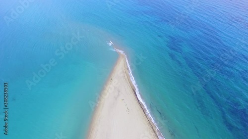 Akra Epanomi - The end of the sand beach and turquoise sea on the both sides of the beach  photo