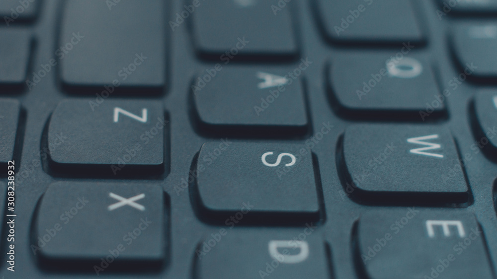 Modern black laptop keyboard closeup, english alphabet. Modern black laptop keyboard closeup, english alphabet.