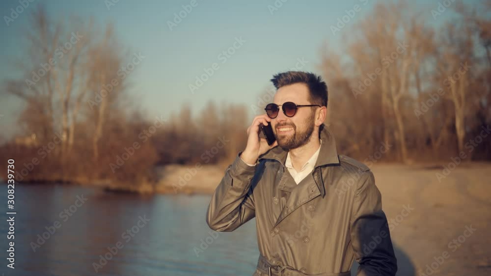 Businessman Talking On Smartphone Or Cell Phone.Man Talking On Mobile Phone.Handsome Successful Confident Businessman Talking On Phone.Attractive Businessman In Sunglasses Using Mobile Phone And Call	