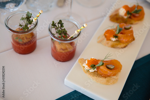 Food served on table in a white hall during a Birthday party in Eastern European Baltic Riga Latvia - Blue and teal colors - Canape, snacks and light drinks