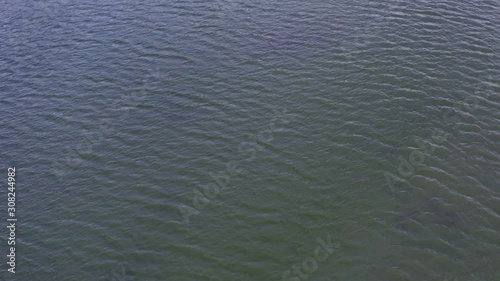 Static aerial shot of a waves on lake