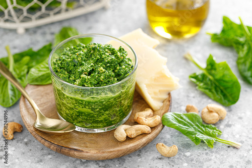 Spinach pesto sauce with cashew, parmesan cheese and olive oil