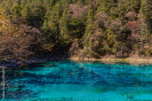 Stuuning view of beautiful pond in Jiuzhaigou national park on a sunny autumn day