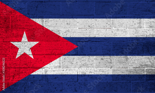 Flag of Cuba on old brick wall background 