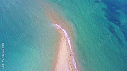 Akra Epanomi - The end of the sand beach and turquoise sea on the both sides of the beach  photo