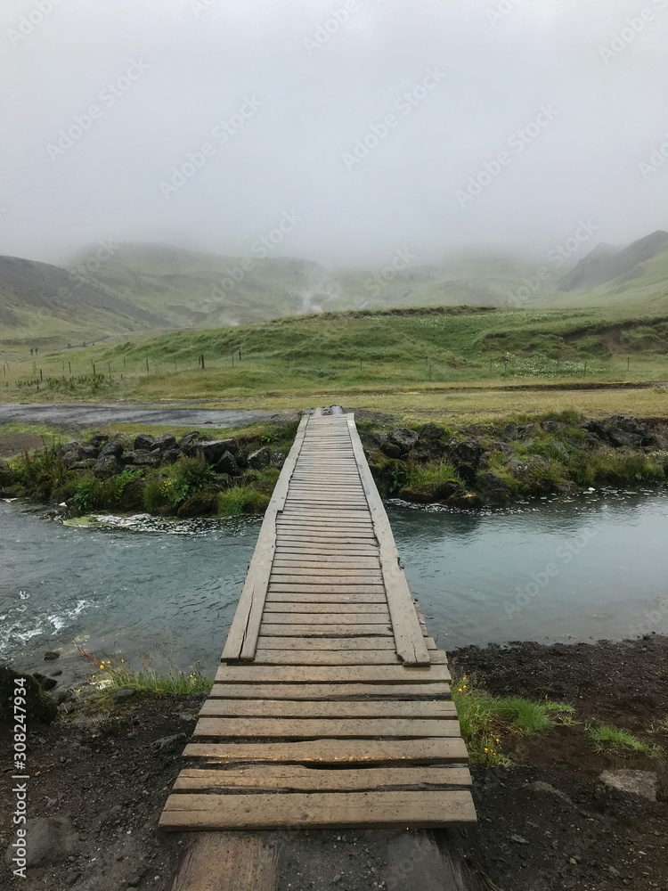 wooden bridge over creek