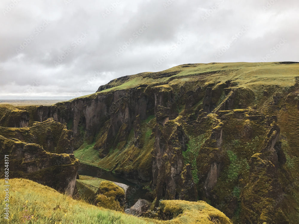 Icelandic canyon with creek running through it