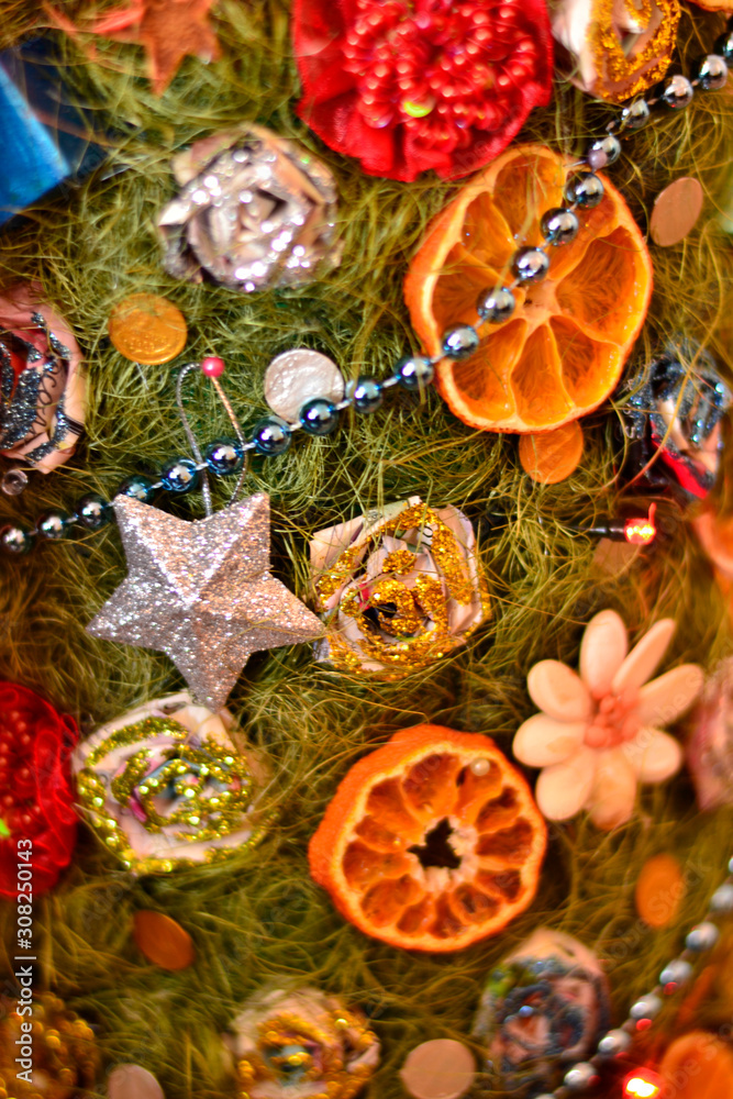 Homemade Christmas tree with, decorations made of paper, Mandarin and electric garland 