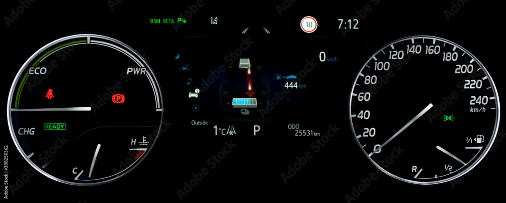 Car dashboard in hybrid car. Close up shot of display indicating battery charge level, speedometer, power monitor, odometer, fuel gauge. Car counter showing energy monitor of engine and battery use.