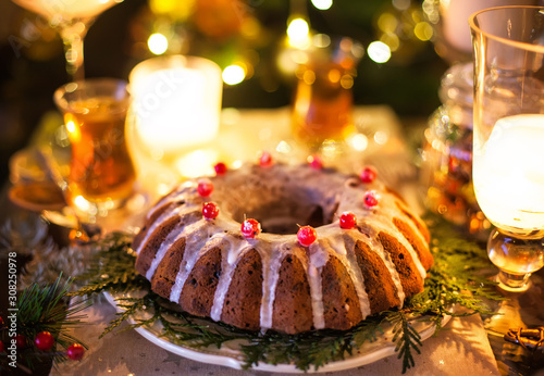 Traditional Christmas cake with dried fruits, raisins and nuts with Christmas decoration