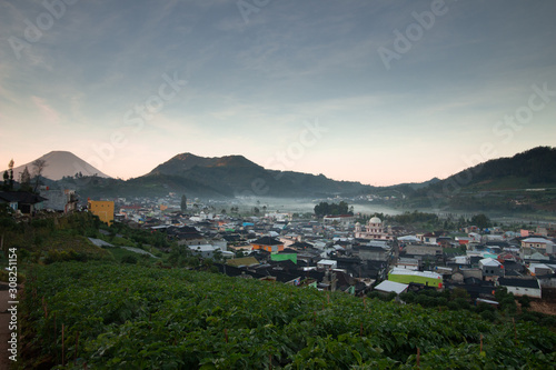 the beauty of the dieng plateau in the morning and the mist enveloping it