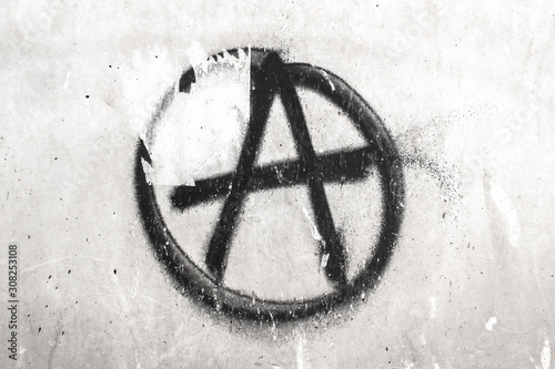 Symbol of Anarchy painted on a wall photo