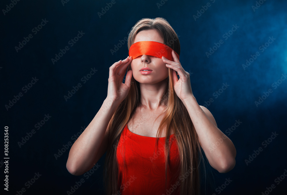 girl blindfolded, red ribbon, game on a dark blue background girl blindfolded, red ribbon, game on a dark blue background