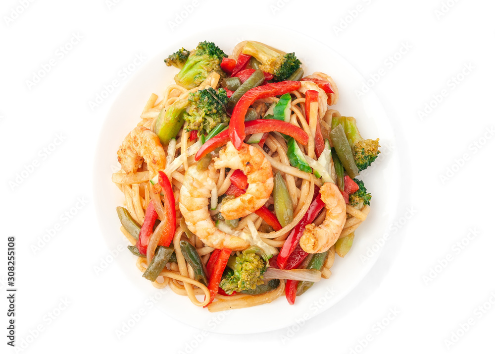 Wheat noodles - udon. With shrimp, salmon fillet, mussels, paprika, onions, broccoli, green beans, cucumber and oyster sauce. On a white plate. White background. Isolate View from above.