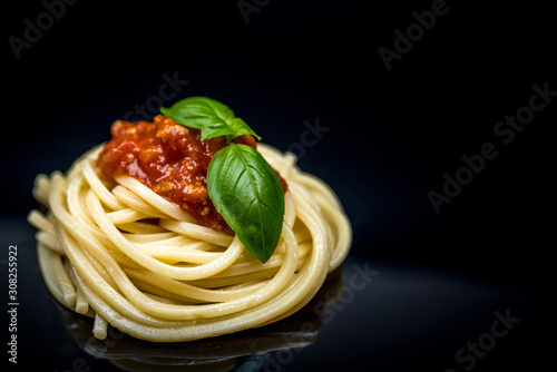 Italian spaghetti on black