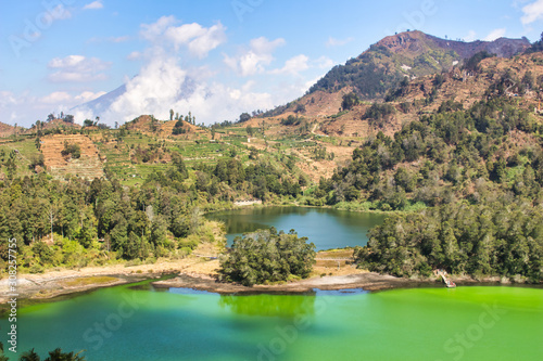 beautiful landscape view of the Telaga Warna lake surrounded by trees  taken from the height area aerial view  selectively focused