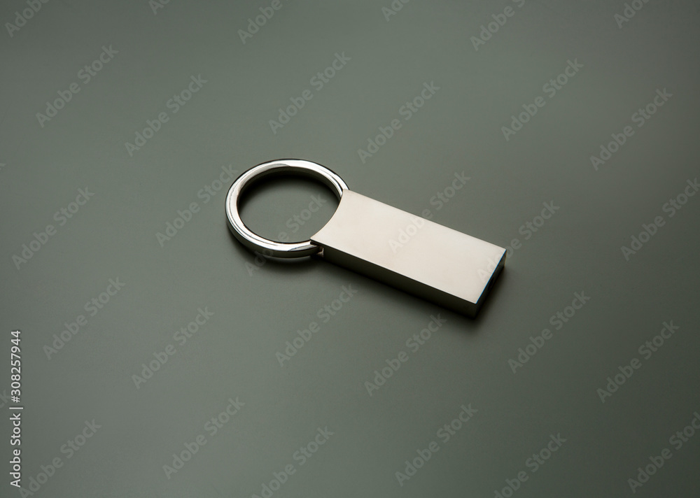metallic squared key chain on dark background metallic squared key chain on dark background