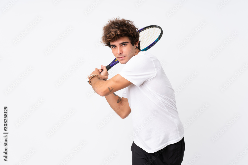 Young caucasian man over isolated white background playing tennis Young caucasian man over isolated white background playing tennis