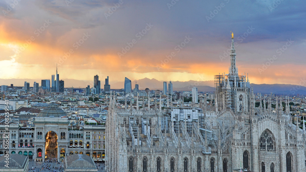 Fototapeta premium Italy Milan - skyline of the city - Duomo Cathedral and new skyscrepers building during a sunset