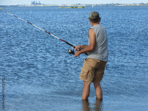 A man fishing at Isla Blanca Park by the Padre Island Causeway