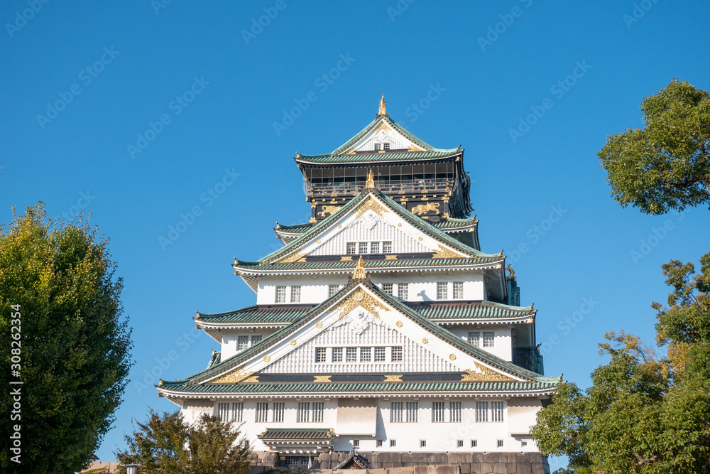 Osaka Castle in Osaka with autumn leaves. Japan Travel Concept Osaka Castle in Osaka with autumn leaves. Japan Travel Concept