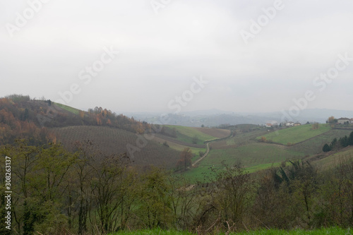 Landscape with mountains, hills and fog on the horizon