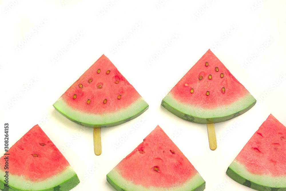 summer watermelon slice popsicles on white background. copy space for designer summer watermelon slice popsicles on white background. copy space for designer