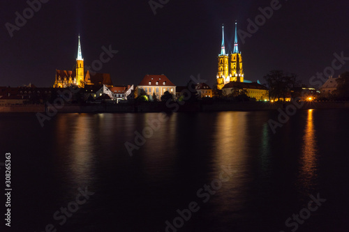 Wroclaw. View at night of the historical district Ostrow Tumski with the spires illuminated of the cathedral of St. John the Baptist