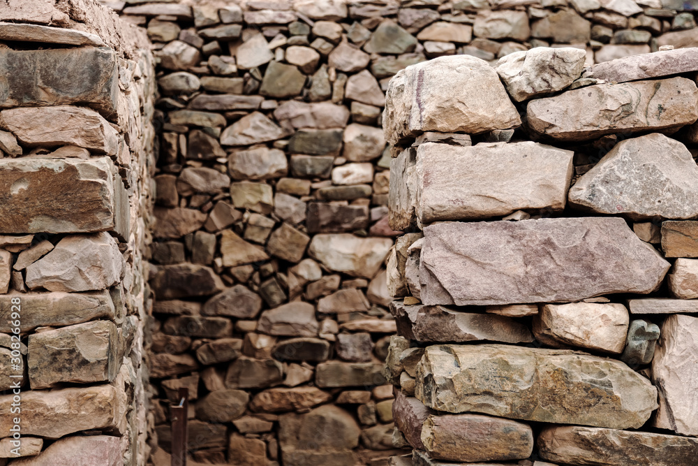 Fototapeta premium Macro close-up focused on foreground of stones in Pucara de Tilcara in Jujuy, Argentina