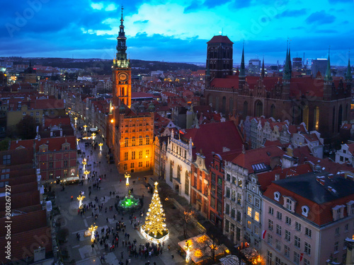Aerial view of the old town in Gdansk with beautiful christmas tree at dusk, Poland