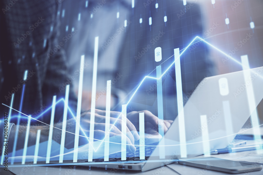 Double exposure of market chart with man working on computer on background. Concept of financial analysis. Double exposure of market chart with man working on computer on background. Concept of financial analysis.