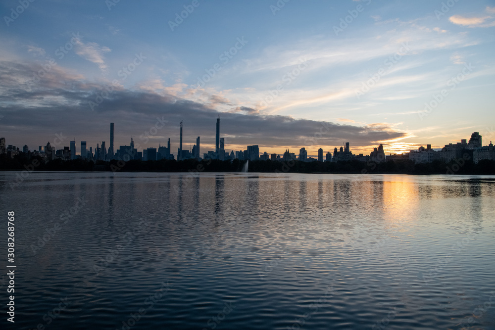 (Wide-angle) Skyline at Jacqueline Kennedy Onassis Reservoir at Sunset at Central Park, Manhattan, New York