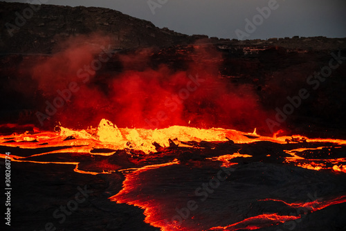 Waves of lava at the surface of Erta Ale lava lake photo