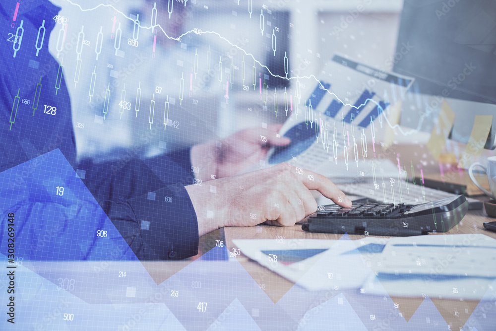 Double exposure of graph with man typing on computer in office on background. Concept of hard work. Closeup. Double exposure of graph with man typing on computer in office on background. Concept of hard work. Closeup.