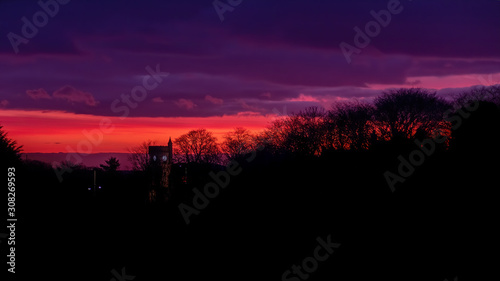 Brora War Memorial at sunrise with dawn colours in the sky © HighlandBrochs.com