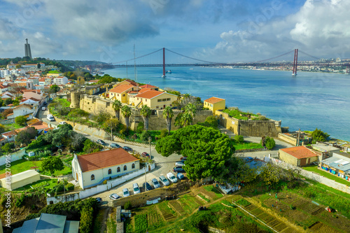 Aerial view of Almada castle with the Targus river and the April 25th bridge in the background photo