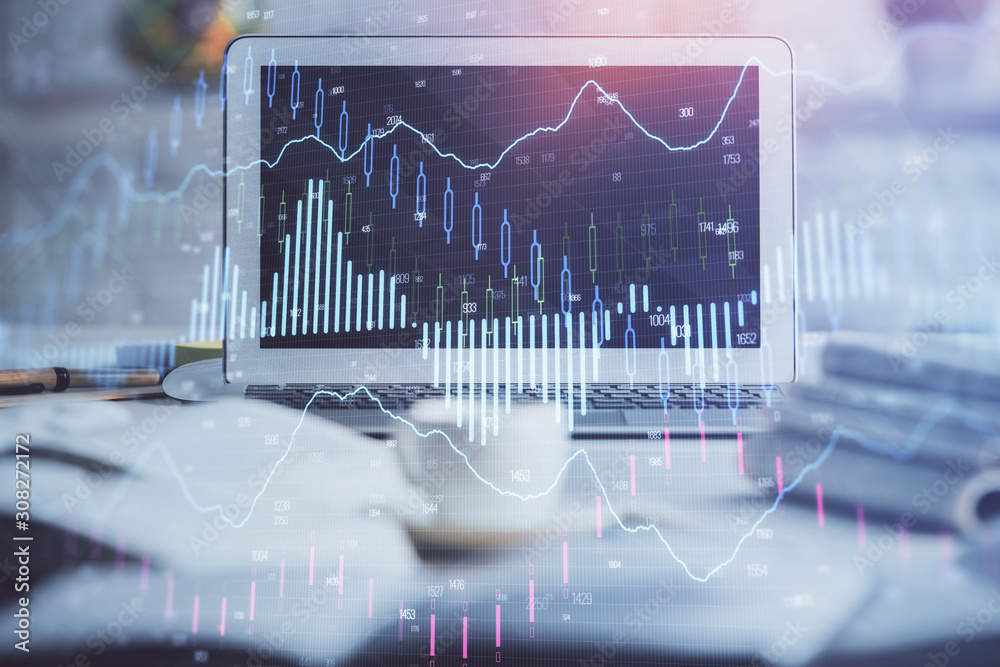 Financial chart drawing and table with computer on background. Double exposure. Concept of international markets. Financial chart drawing and table with computer on background. Double exposure. Concept of international markets.